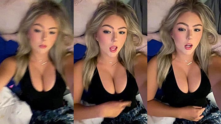 sexy blonde Hailey Sigmond in bed showing her cleavage